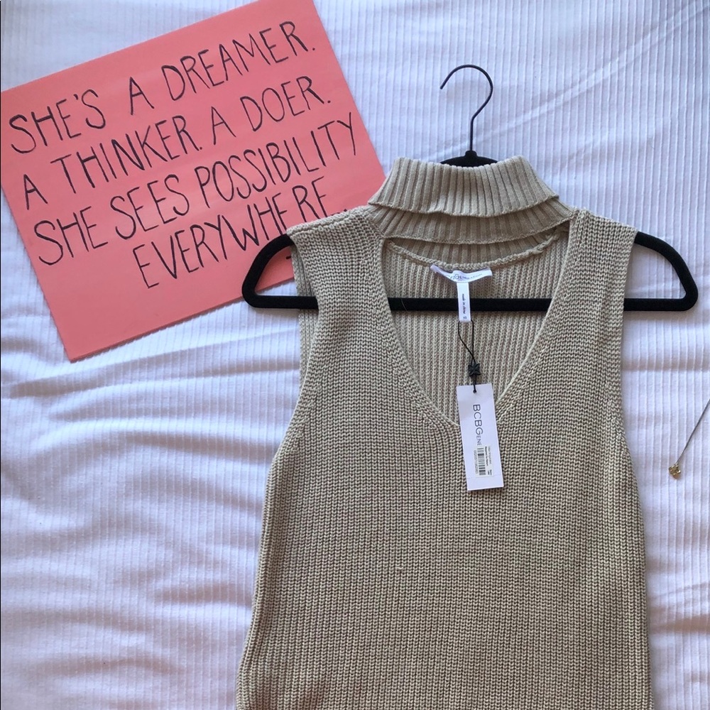 NWT sleeveless BCBG knit sweater. Never been worn.